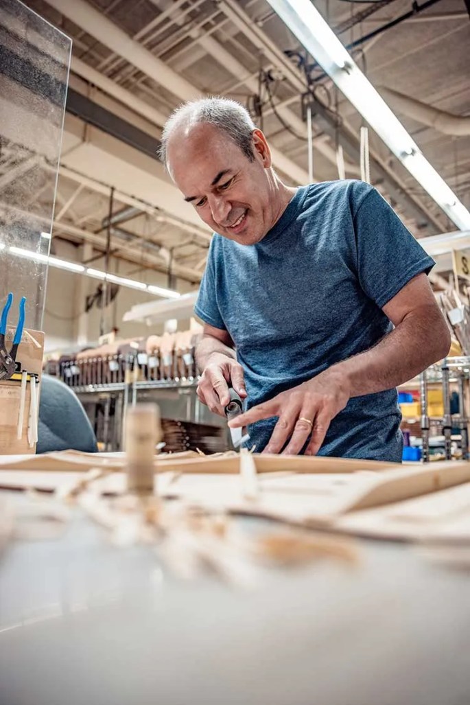 Thomas Ripsam CEO of CF Martin and Co building an acoustic guitar