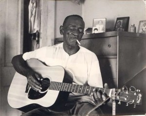 Mance Liscomb playing acoustic guitar