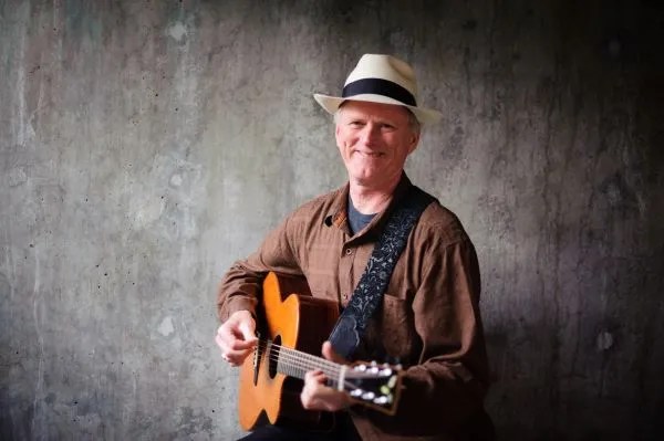 Mark Hanson playing acoustic guitar