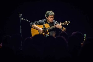Peppino D'Agostino onstage playing guitar
