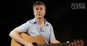 Andrew DuBrock with acoustic guitar