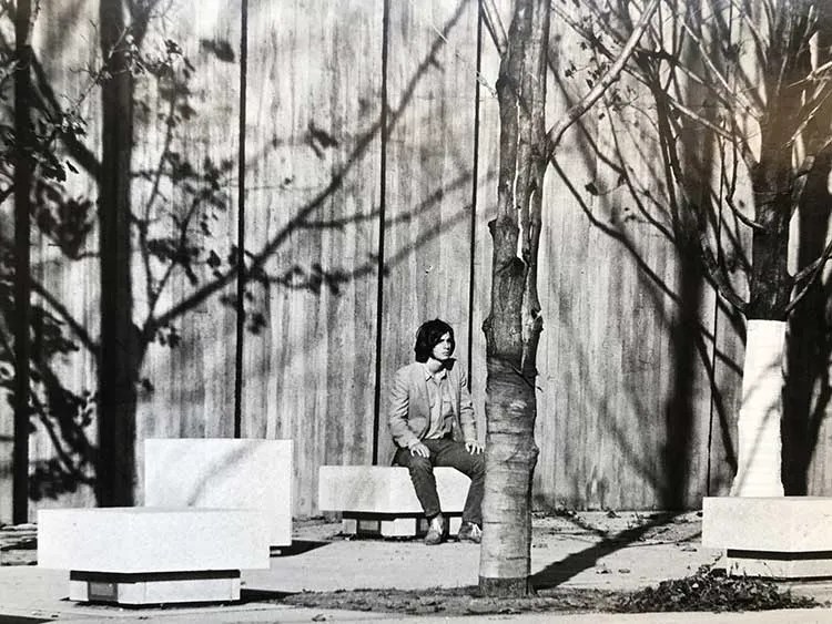 Steve James seated on a park bench
